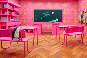 Immersive retail space inspired by anemoia, featuring vibrant pink interiors, nostalgic design elements, and themed experiential environments that create emotional connections with consumers.