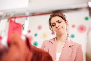 consumer experiencing frustration during the shopping journey inside a fashion retail store